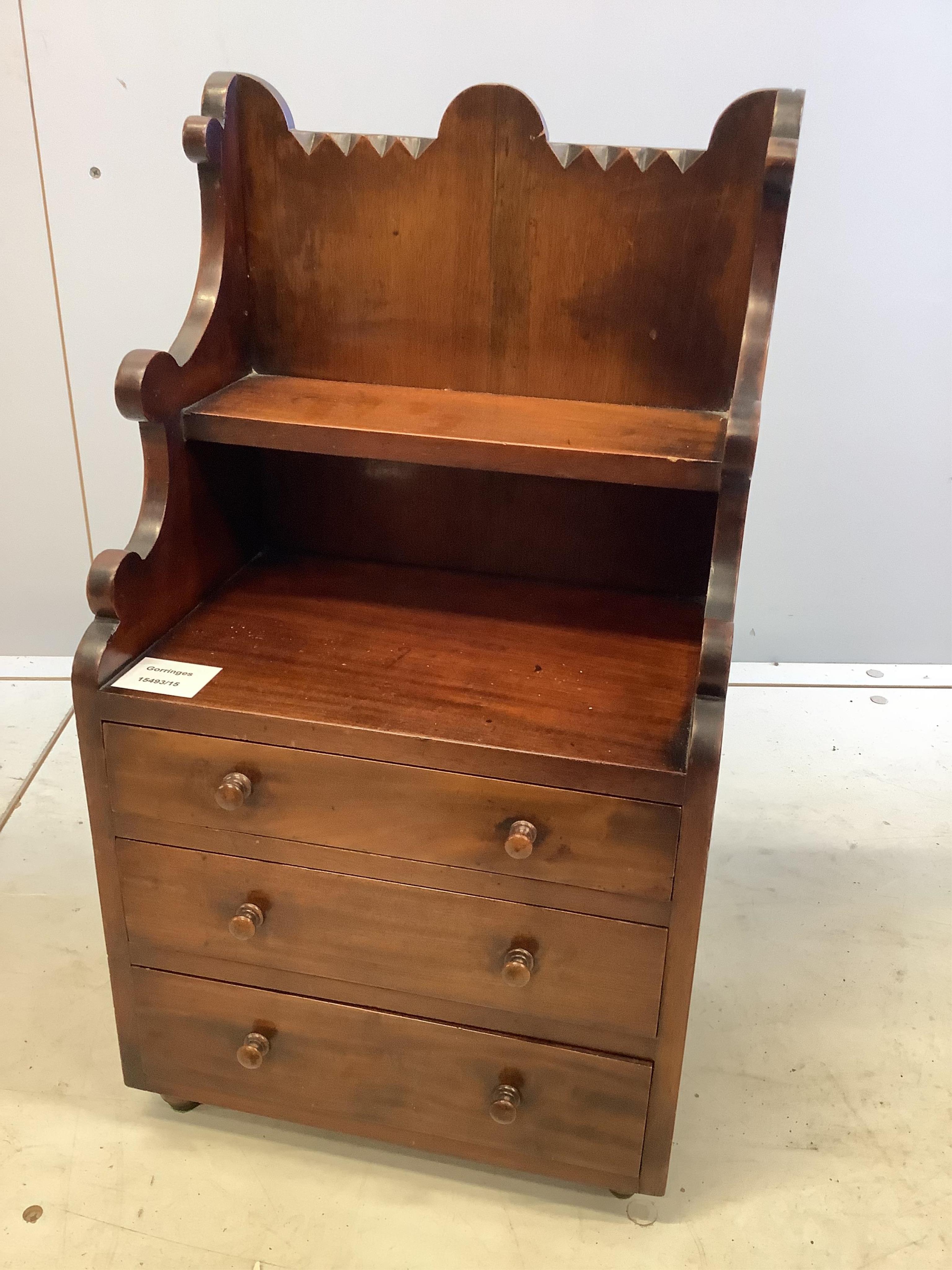 A late Victorian mahogany miniature chest, with a shelf over, width 29cm, depth 20cm, height 54cm. Condition - fair to good